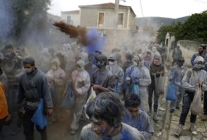 The flour smudging or "flour war" during the celebration of Clean Monday in the greek Carnival, at the port town of Galaxidi, some 200 km west of Athens. On March 18, 2013 / Αλευρομουτζουρώματα στην κωμόπολη του Γαλαξειδίου, στο νομό Φωκίδας την Καθαρά Δευτέρα.